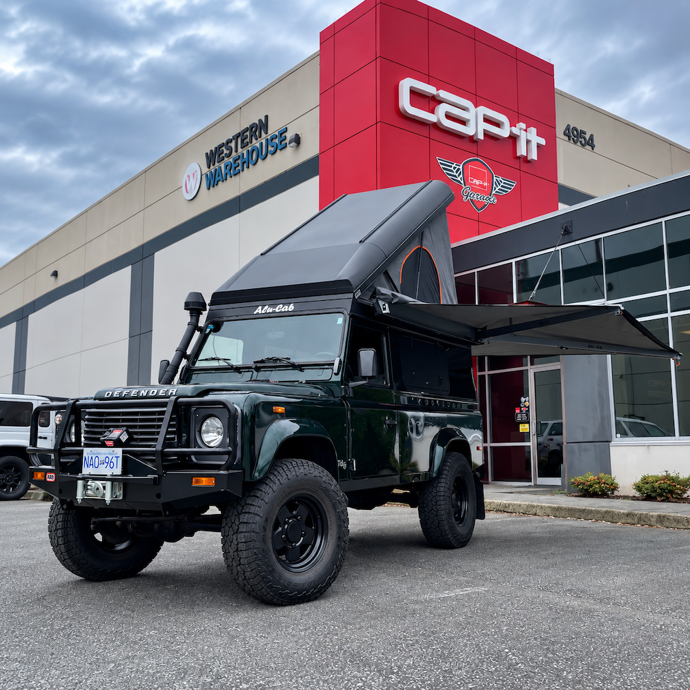 Land Rover Defender 110 with Alu-Cab Icarus Roof Conversion open at Cap-it Canada