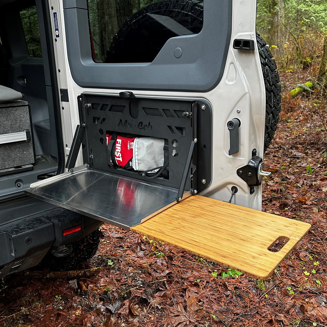 Alu-Cab rear door drop-down table for INEOS Grenadier