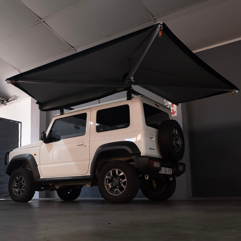 Alu-Cab 2 metre 270 degree Shadow Awning deployed on an adventure vehicle