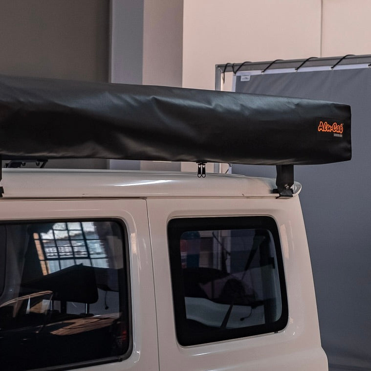 Alu-Cab 2 metre 270 degree Shadow Awning deployed for quick vehicle-based shelter